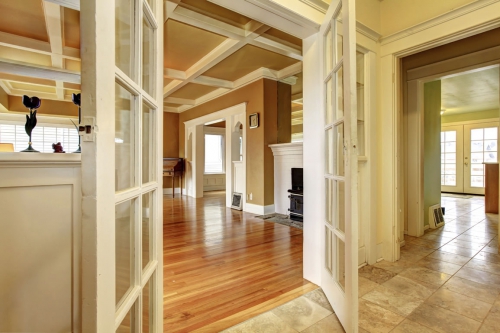 Wood flooring connects to natural stone tile