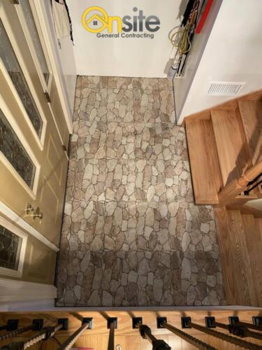 Entry way natural stone installation, porcelain material